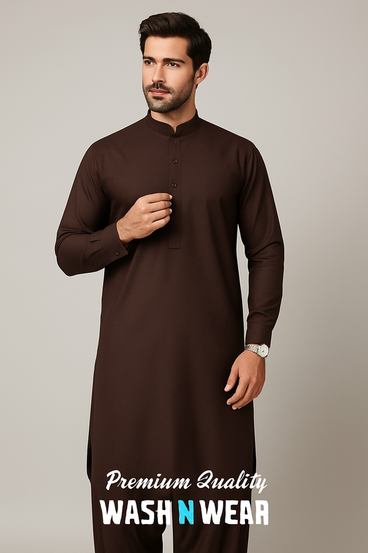 Male model wearing a smartly stitched coco brown shalwar kameez made from premium wash and wear fabric by Gul Ahmed. Outfit styled for summer in a minimal studio background.